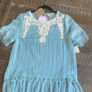 Gauzy short sleeve blouse; color: aqua/teal; size s; damage on left shoulder;NWT
